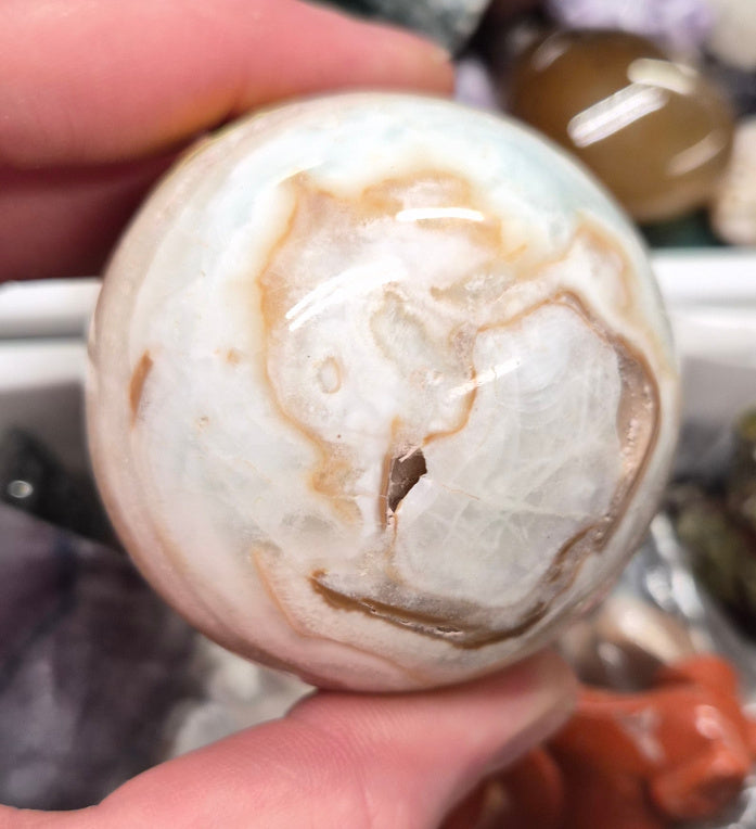 Banded Green Onyx/Caribbean Calcite sphere–55mm