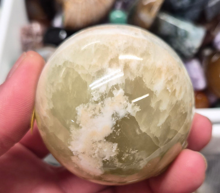Banded Green Onyx/Caribbean Calcite sphere–55mm