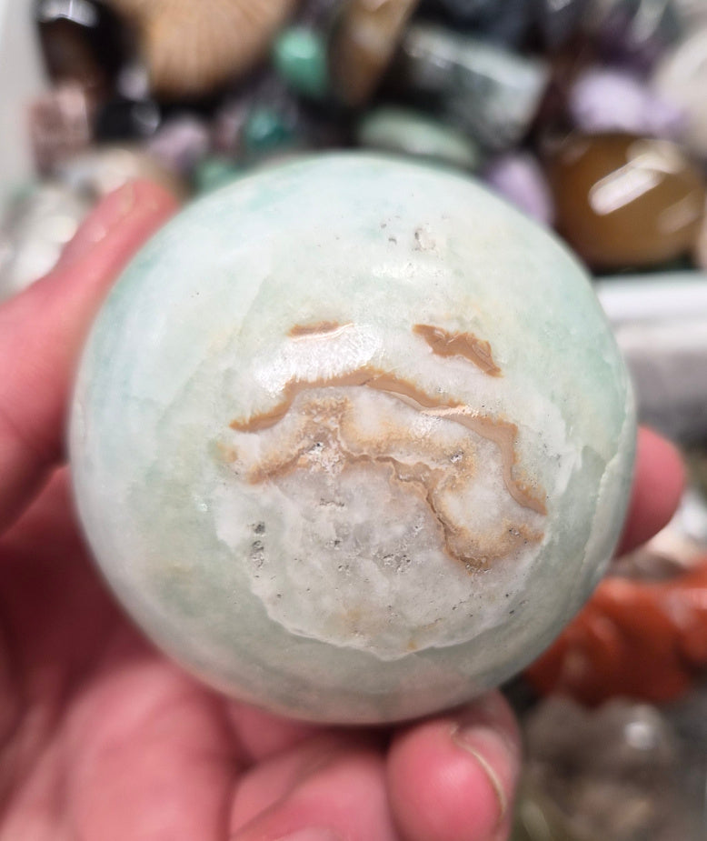 Banded Green Onyx/Caribbean Calcite sphere–55mm