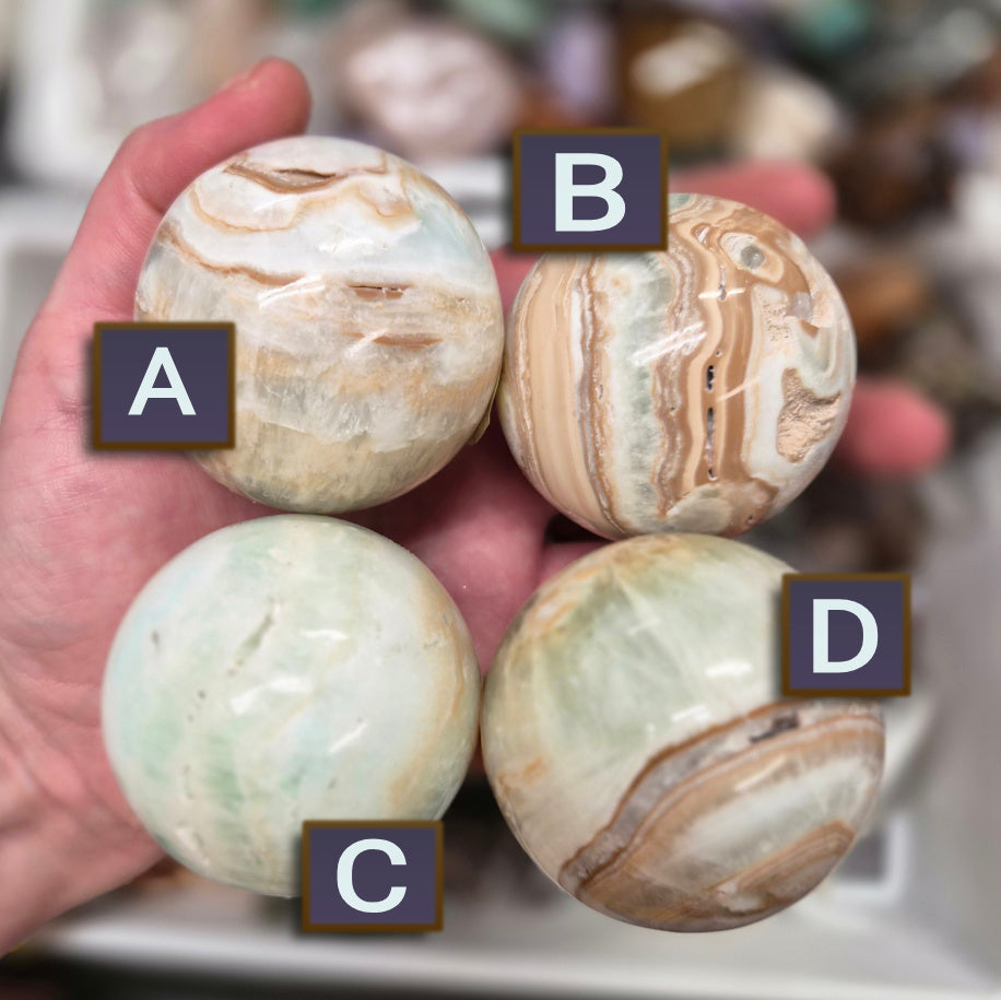 Banded Green Onyx/Caribbean Calcite sphere–55mm