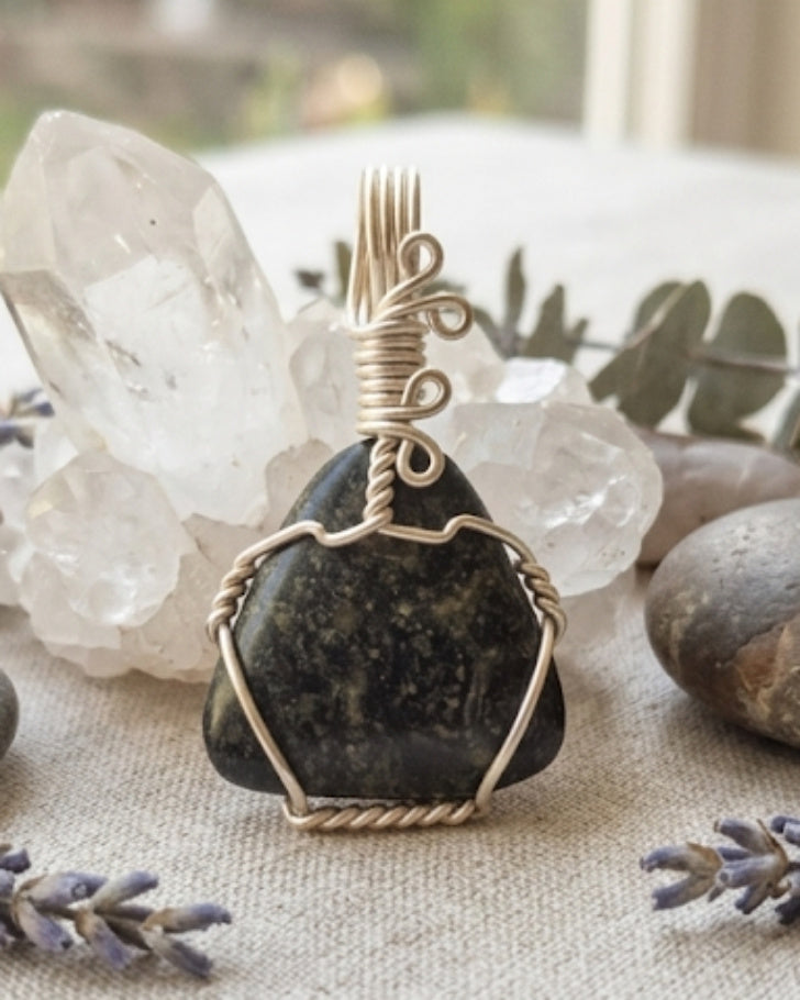 Artisan handcrafted wire wrapped natural crystal pendants