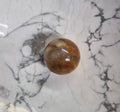 Mini Golden Healer Hematoid Quartz Sphere – 16mm